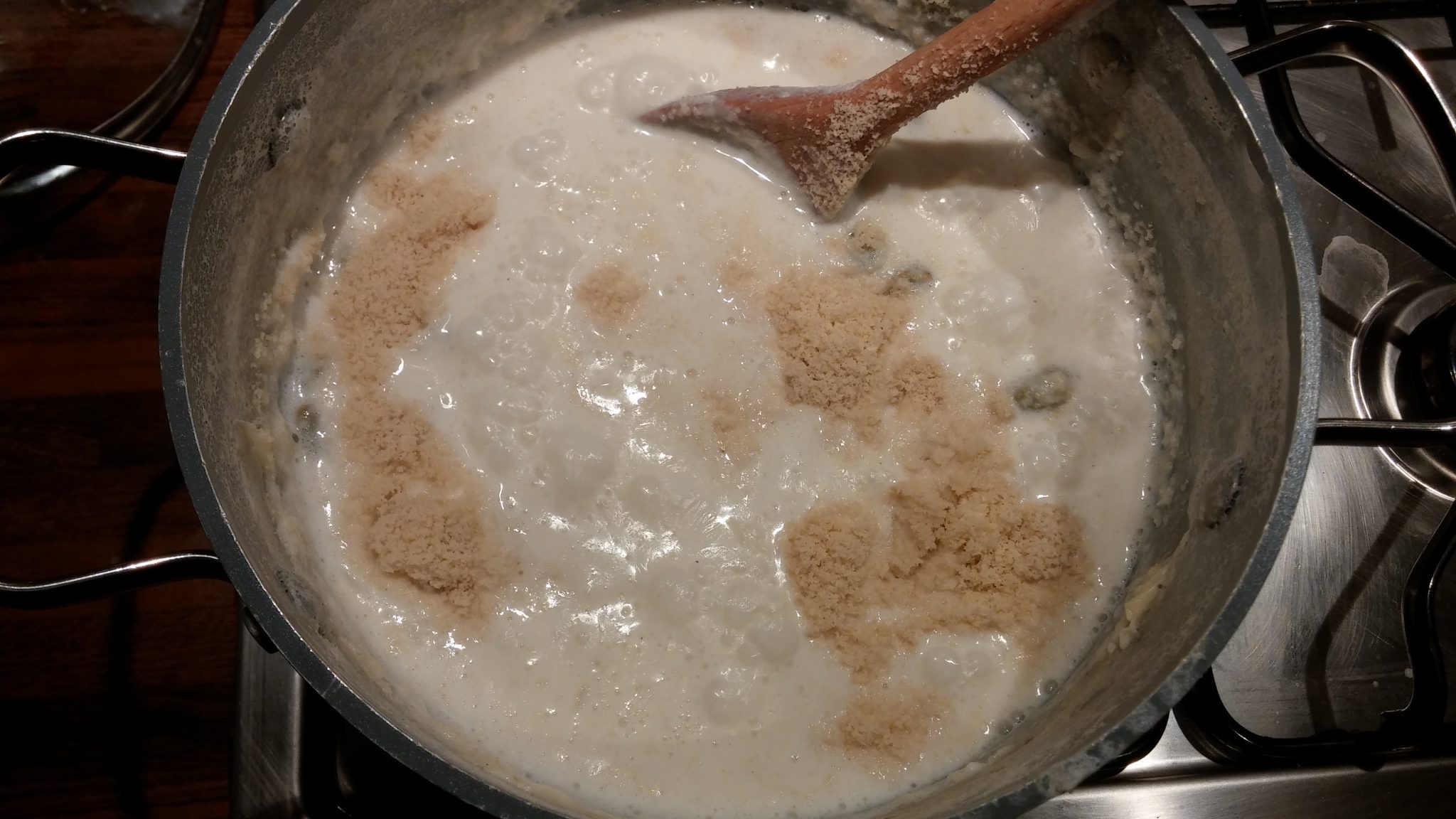 Cooked rice, milk almond powder gently simmering