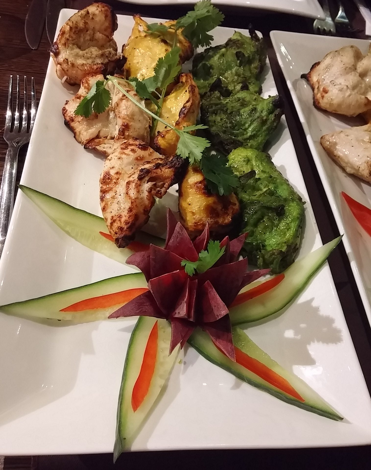 Appetisers of taranga chicken tikka in Indian flag colour: Green: hari chicken tikka (coriander, mint, chilli marinade) White: kaali mirch (black pepper, lychee marinade) Yellow: kesari murgj (saffron infused)