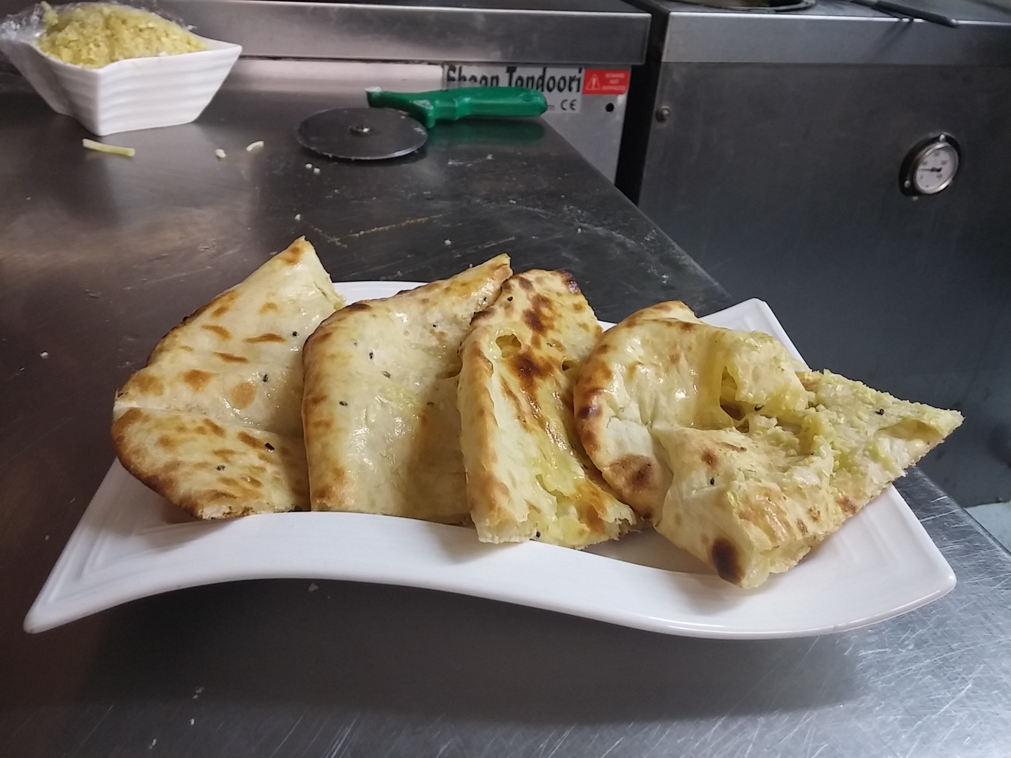 Hot from the tandoor, cheese and garlic naan cooked by the thoroughly fabulous Mr Singh himself
