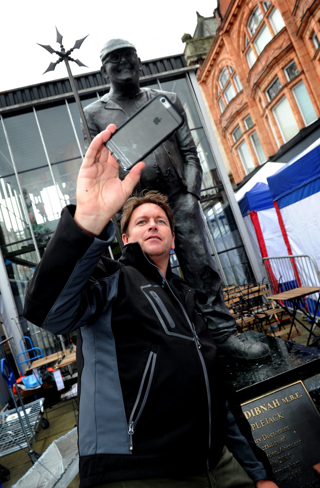 The 10th annual Bolton Food and Drink Festival, Victoria Square, Bolton, Lancashire. Star attraction on the final day was chef James Martin, who couldn't resist a selfie with the Fred Dinah statue in the town. Picture by Paul Heyes, Monday August 31, 2015.