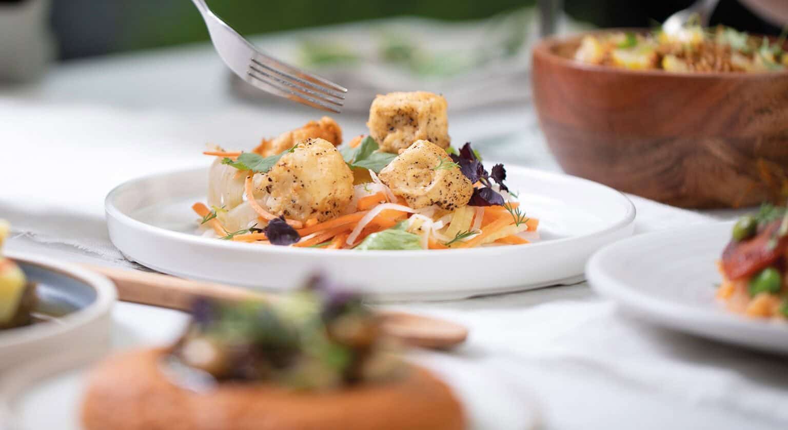 Vegan crispy tofu on fork