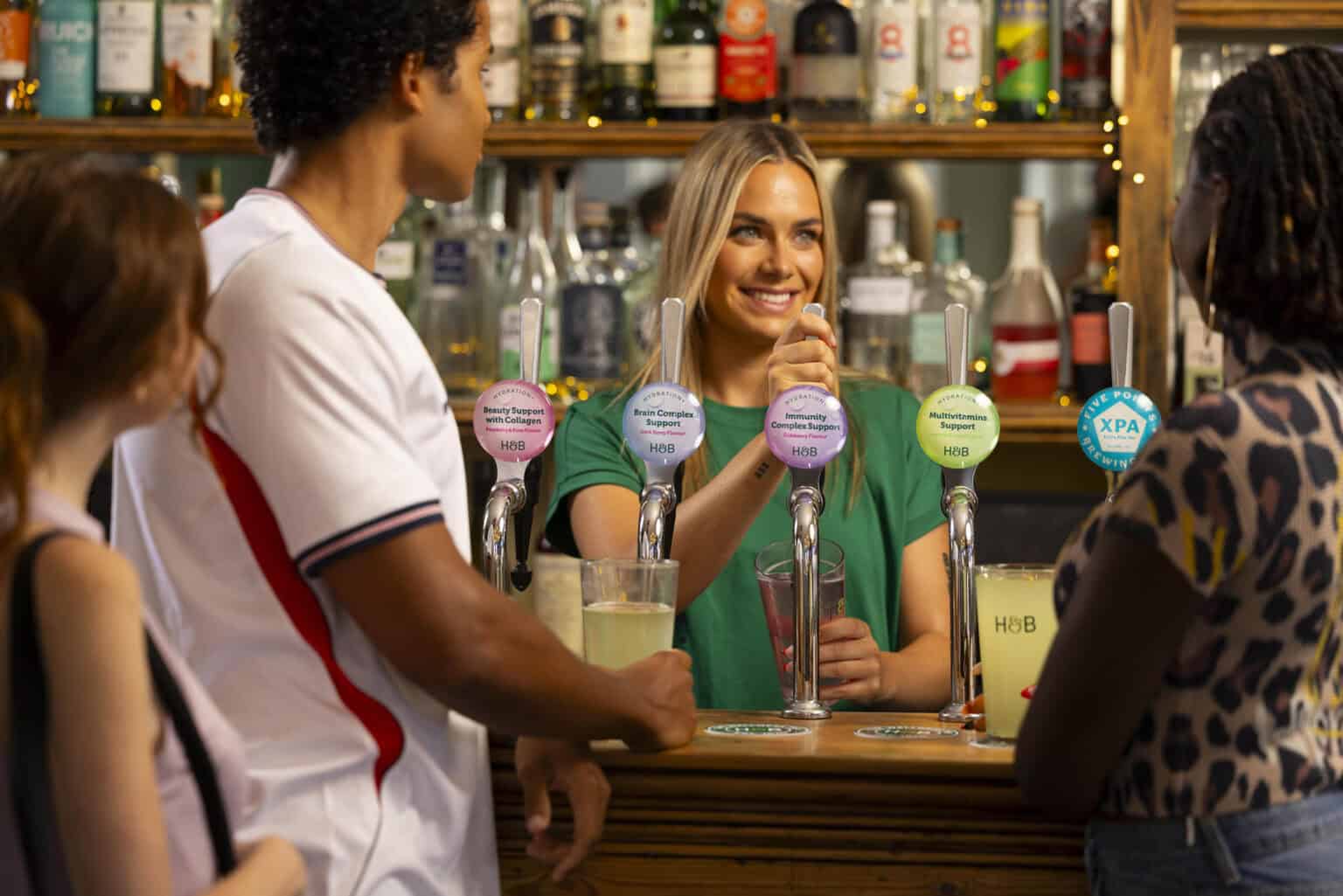 Man and woman in pub drink at the bar