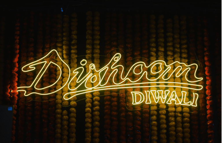 Dishoom Diwali in lights against a flower background